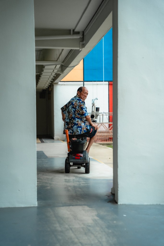Image of uncle riding a PMD at Teck Whye Avenue
